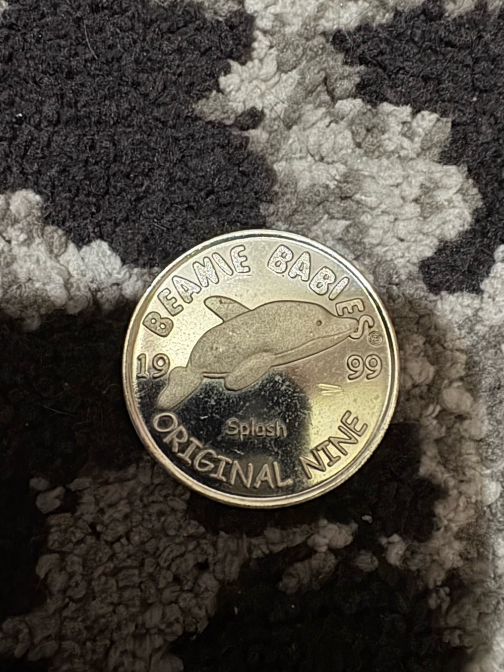Beanie Babies metal coin.